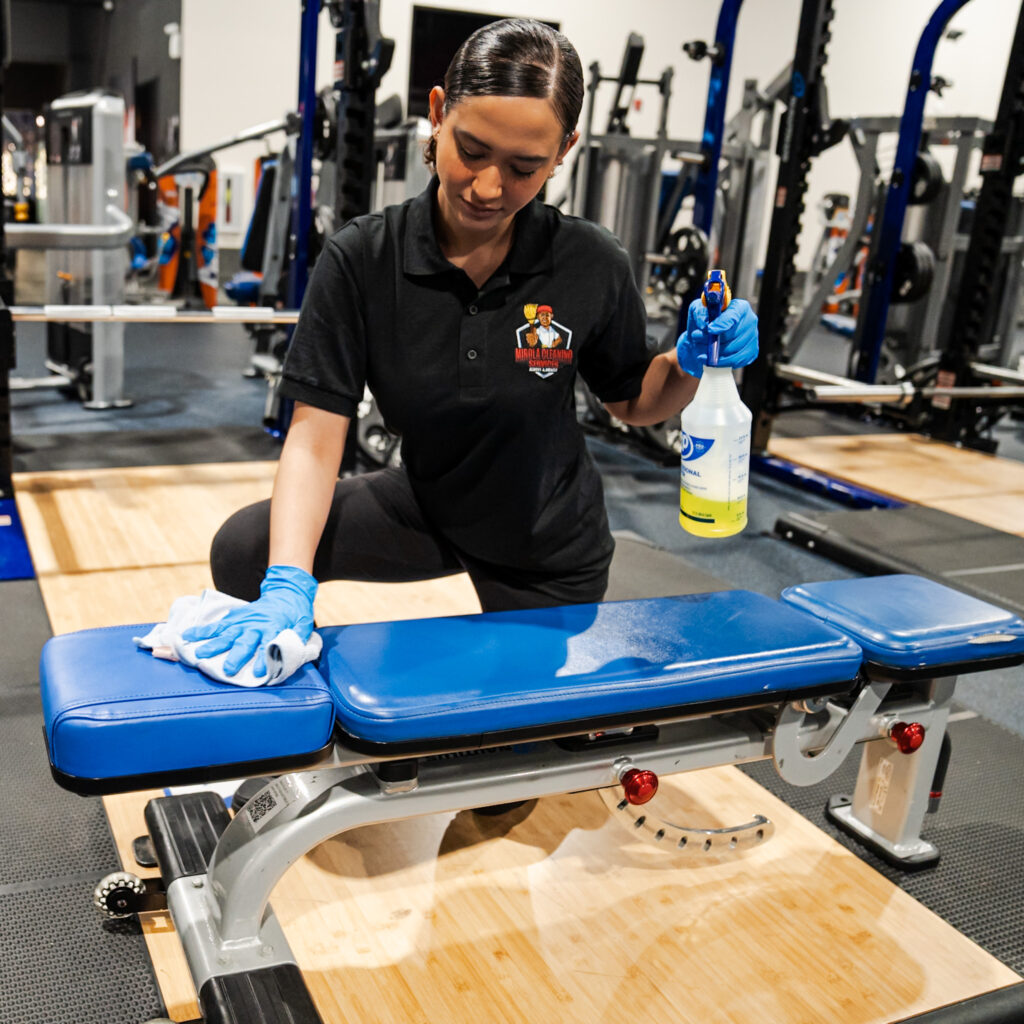 ways to keep your gym clean - mirola cleaning services carrying out a deep clean on gym seats